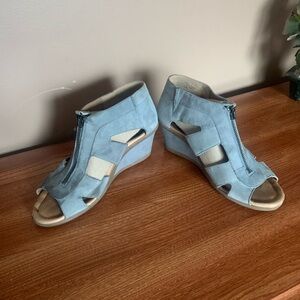 These wedges have a front zipper,slip on. Powder blue suede wedges in size 8.